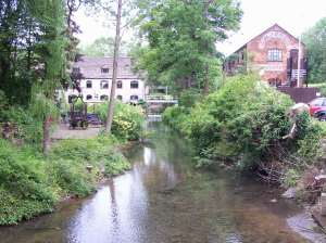 Nailsworth. Old Railway Goods Yard on the right, across the stream is Egypt Mill on the left.